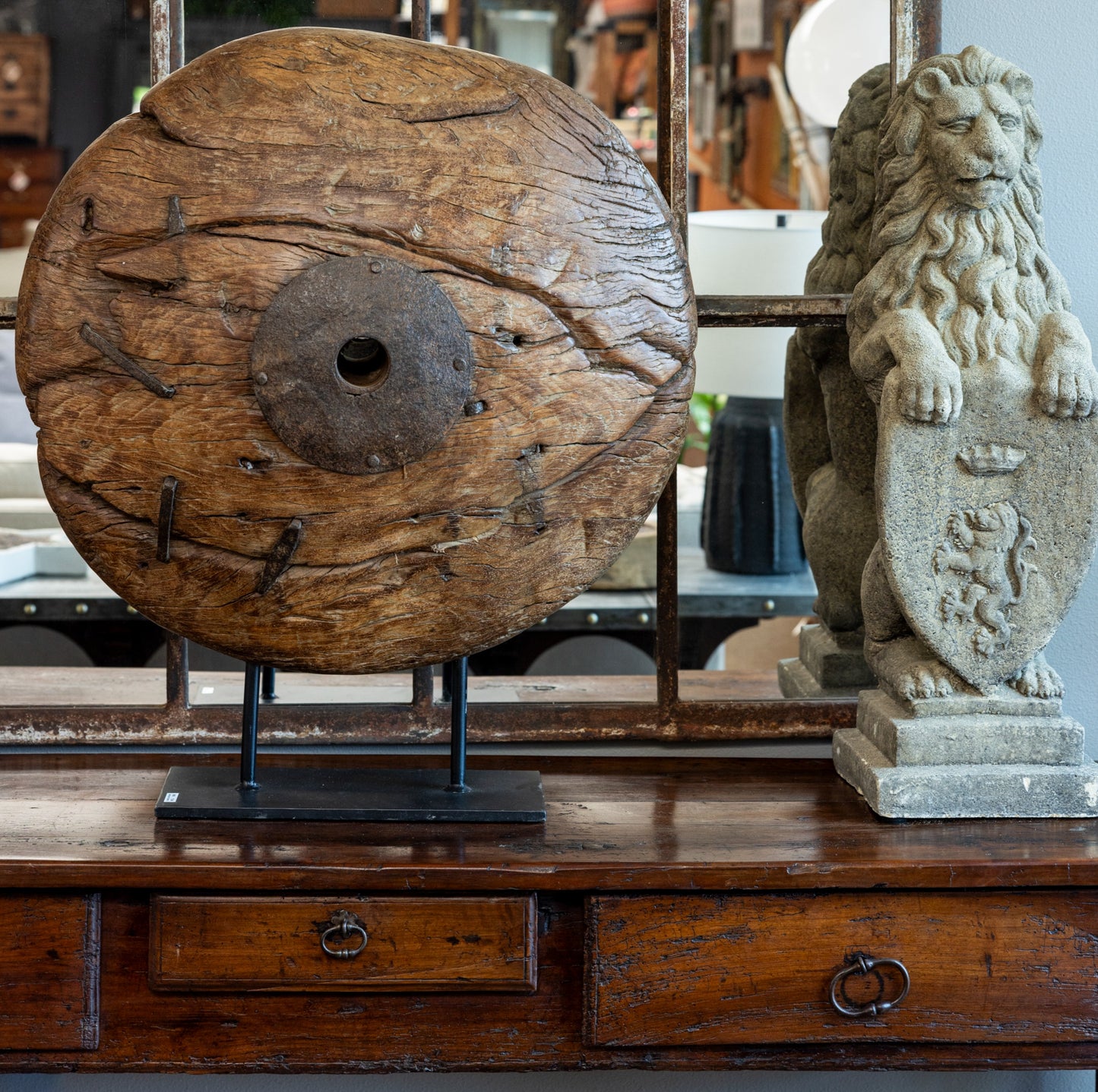 Large Wheel on Stand and Stone Garden Lion