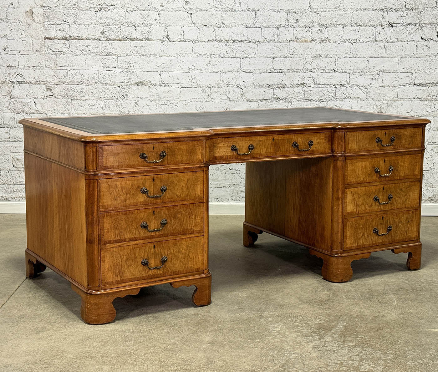 Antique Nine Drawer Birds-Eye Maple Desk with Leather Inlay