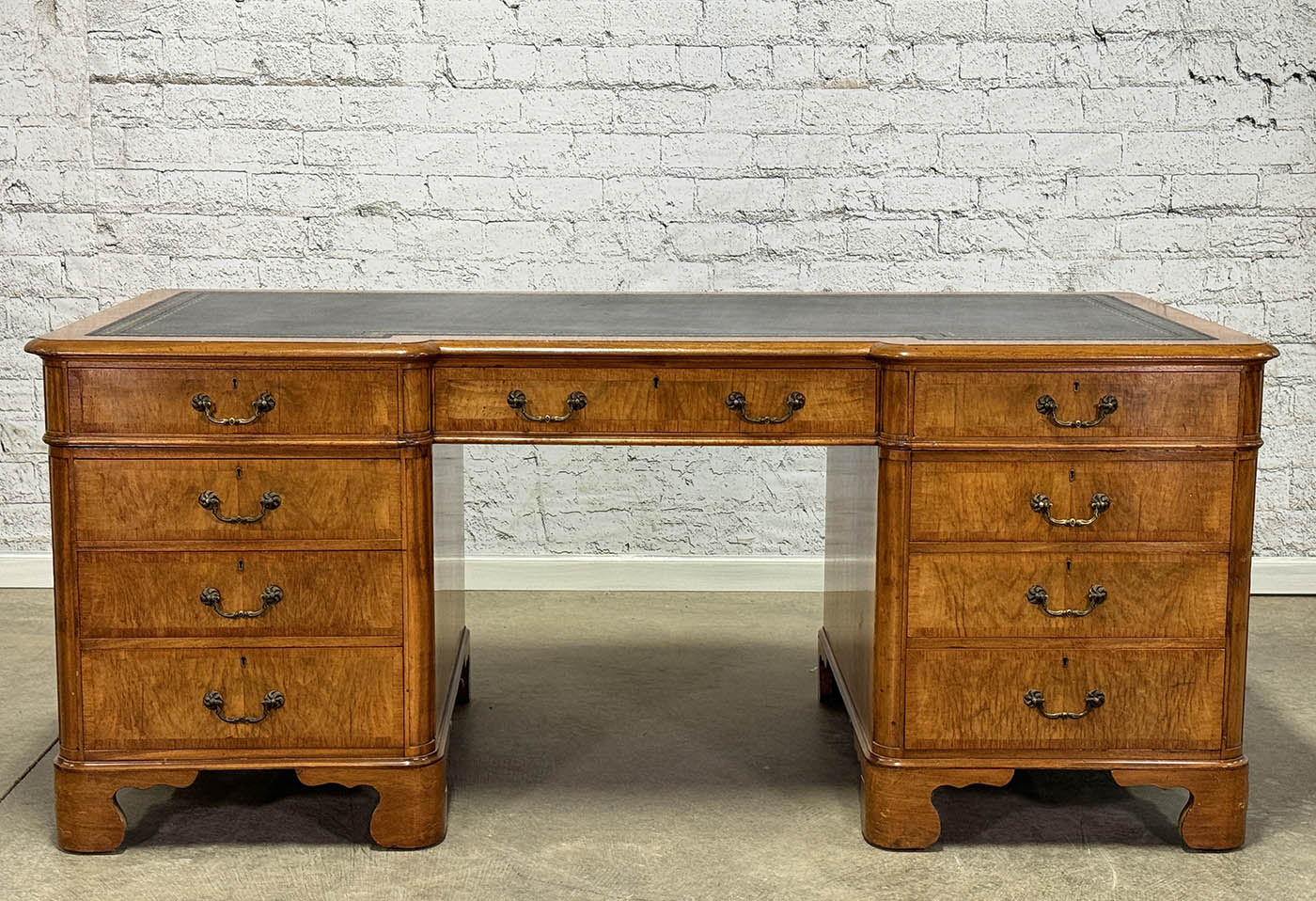Antique Nine Drawer Birds-Eye Maple Desk with Leather Inlay