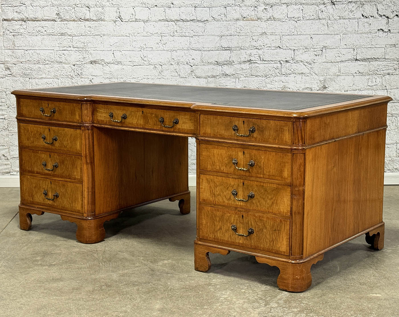Antique Nine Drawer Birds-Eye Maple Desk with Leather Inlay