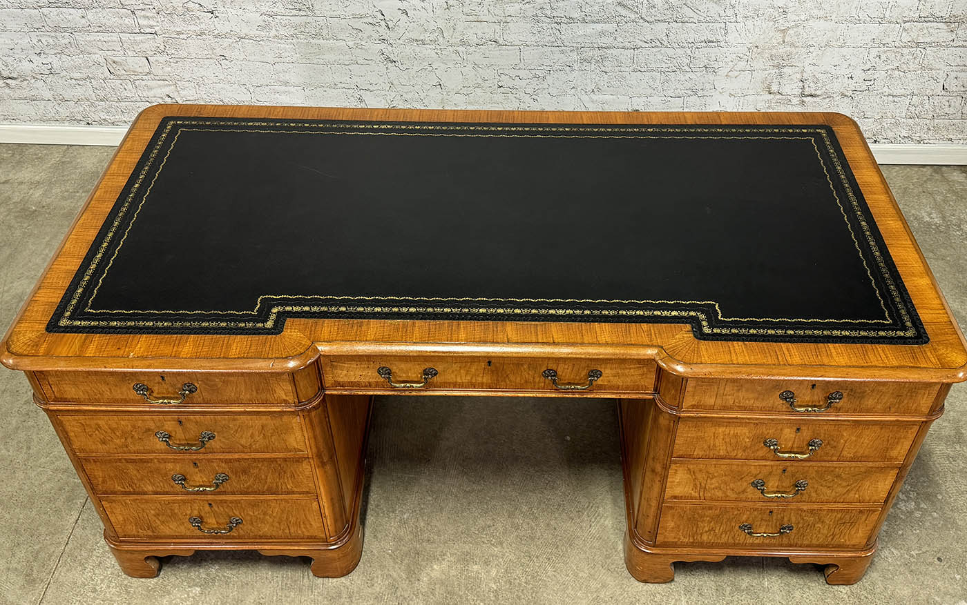 Antique Nine Drawer Birds-Eye Maple Desk with Leather Inlay