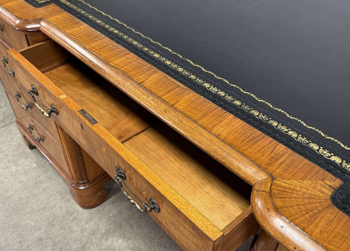 Antique Nine Drawer Birds-Eye Maple Desk with Leather Inlay