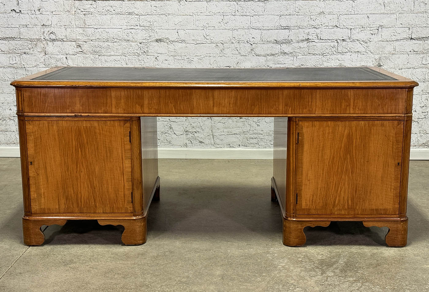 Antique Nine Drawer Birds-Eye Maple Desk with Leather Inlay