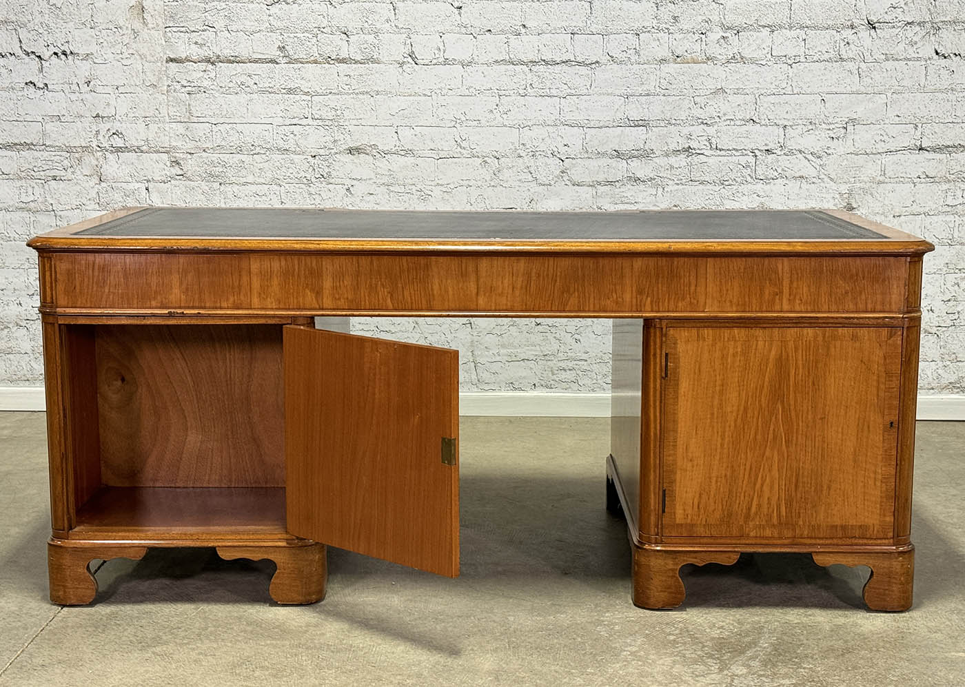 Antique Nine Drawer Birds-Eye Maple Desk with Leather Inlay