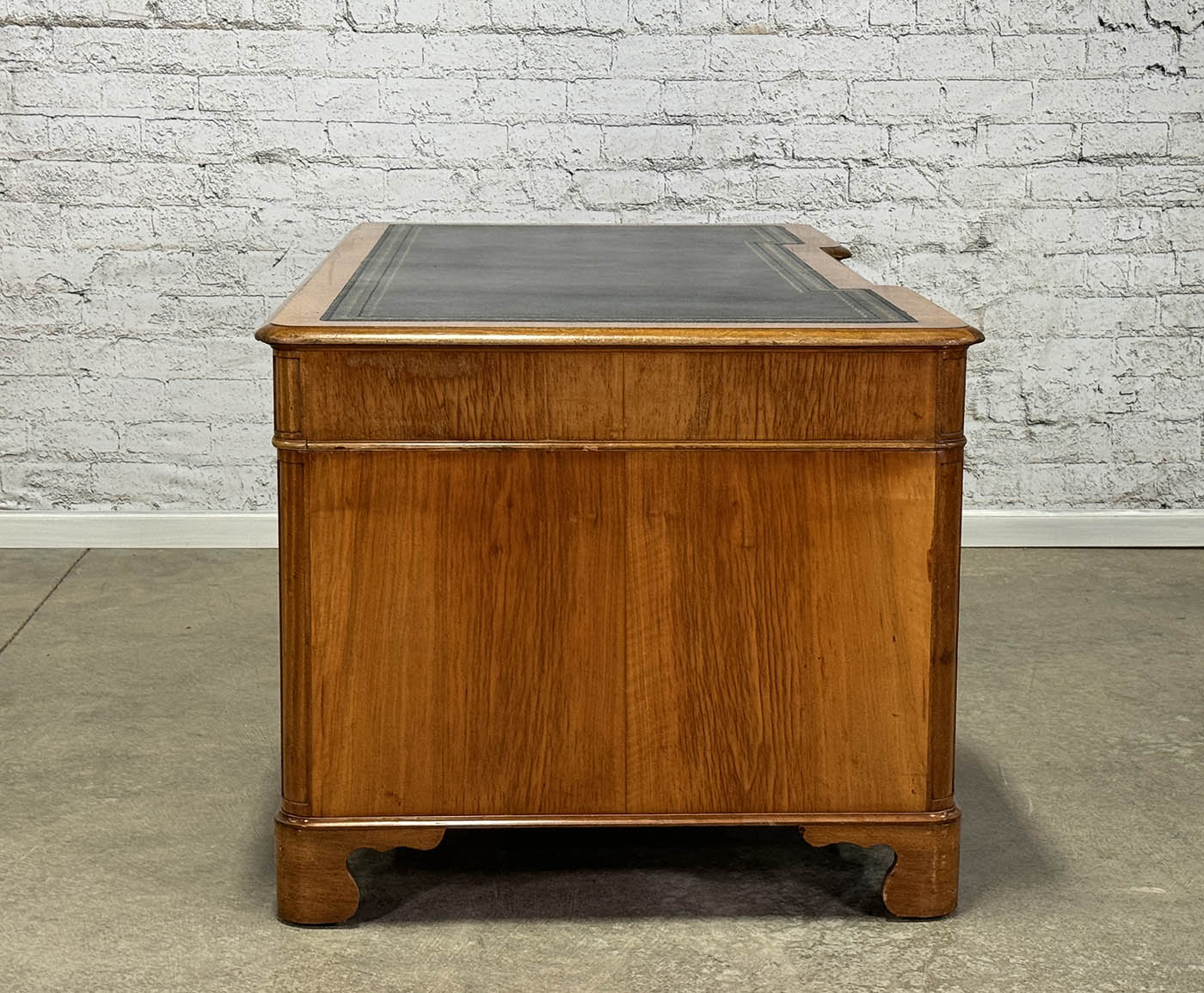 Antique Nine Drawer Birds-Eye Maple Desk with Leather Inlay